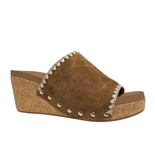 The Stitch N Slide offers a stylish and comfortable option for all-day wear. Its open toe design and sturdy platform provide maximum breathability and support. Complete with brass stud accents, this slide adds a touch of sophistication to any outfit.
