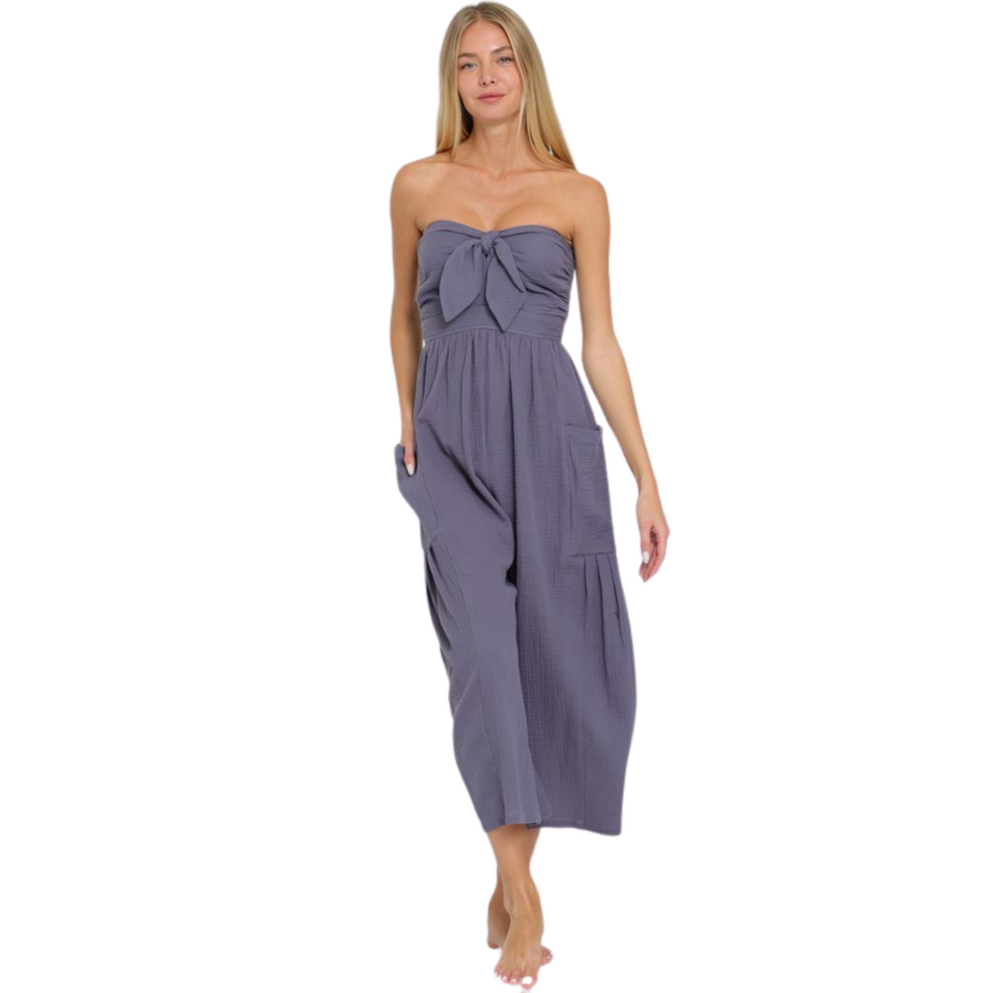 Introducing our Tube Smocked Jumpsuit in a stunning vintage blue color. This strapless jumpsuit features a flattering smocked design that accentuates your curves. With its ankle length and convenient pockets, this jumpsuit is both stylish and functional. Elevate your wardrobe with this must-have piece.