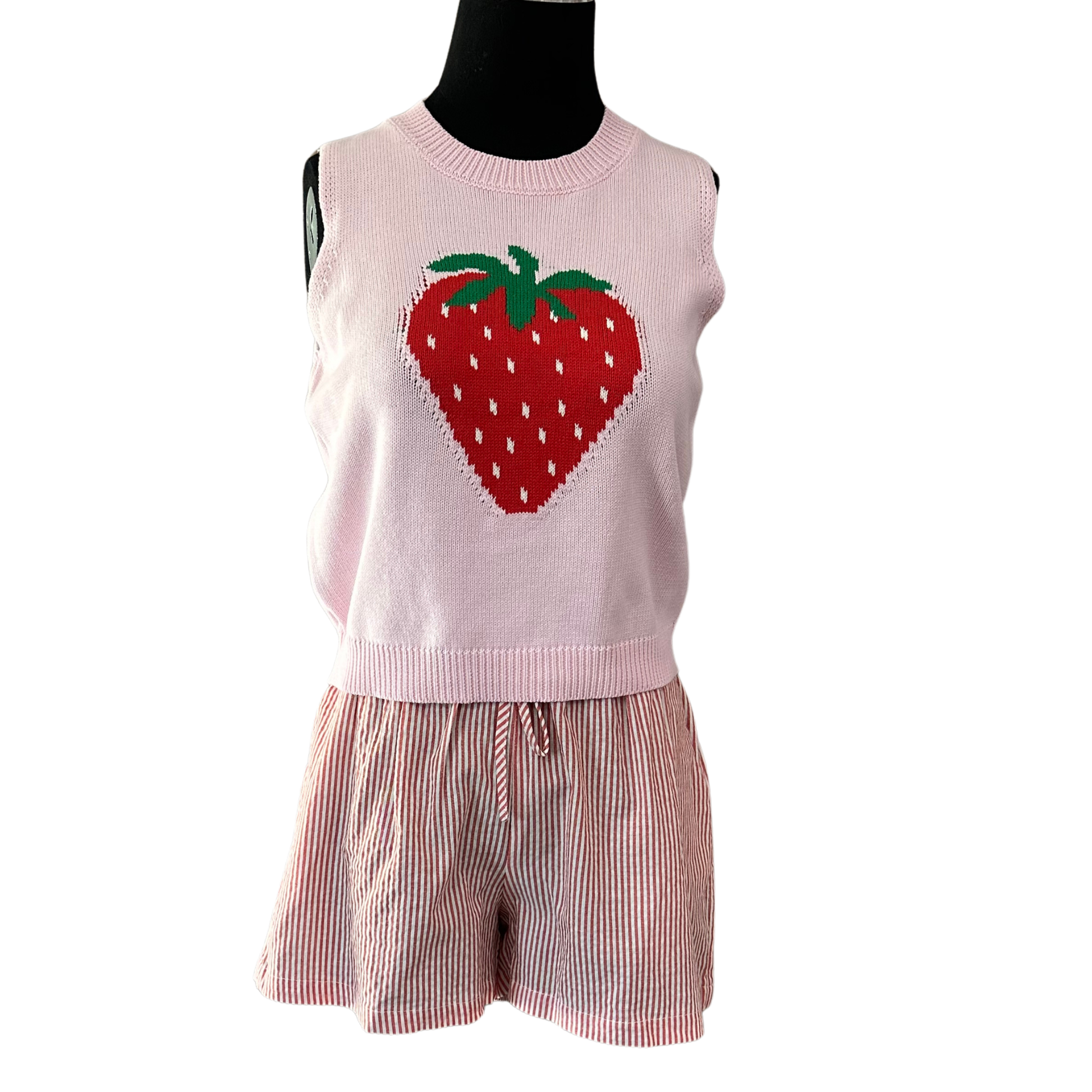 Effortless summer style meets playful design with this HYFVE two-piece set. The sleeveless top features a vibrant strawberry graphic that adds a fun pop of color, while the coordinating striped shorts complete the look. Perfect for casual outings, beach days, or relaxed weekends. Mix and match with your favorite accessories for endless styling possibilities.