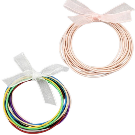 Add a splash of color to your wardrobe with these fashionable stretchy bangles. The corded multi-strand design features multiple colors, including pink or rainbow, for a unique look. Whether you're going to a special event or just want to add some flair to your everyday style, these bangles are the perfect accessory.