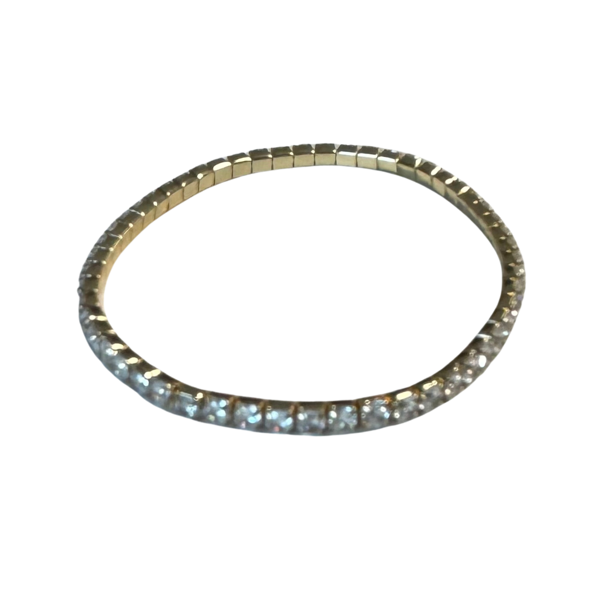 Expertly crafted with delicate rhinestones, this stretchy bracelet adds a touch of elegance to any look. Made with a gold-toned finish, it effortlessly complements any outfit. Elevate your style with this dainty and versatile accessory.
