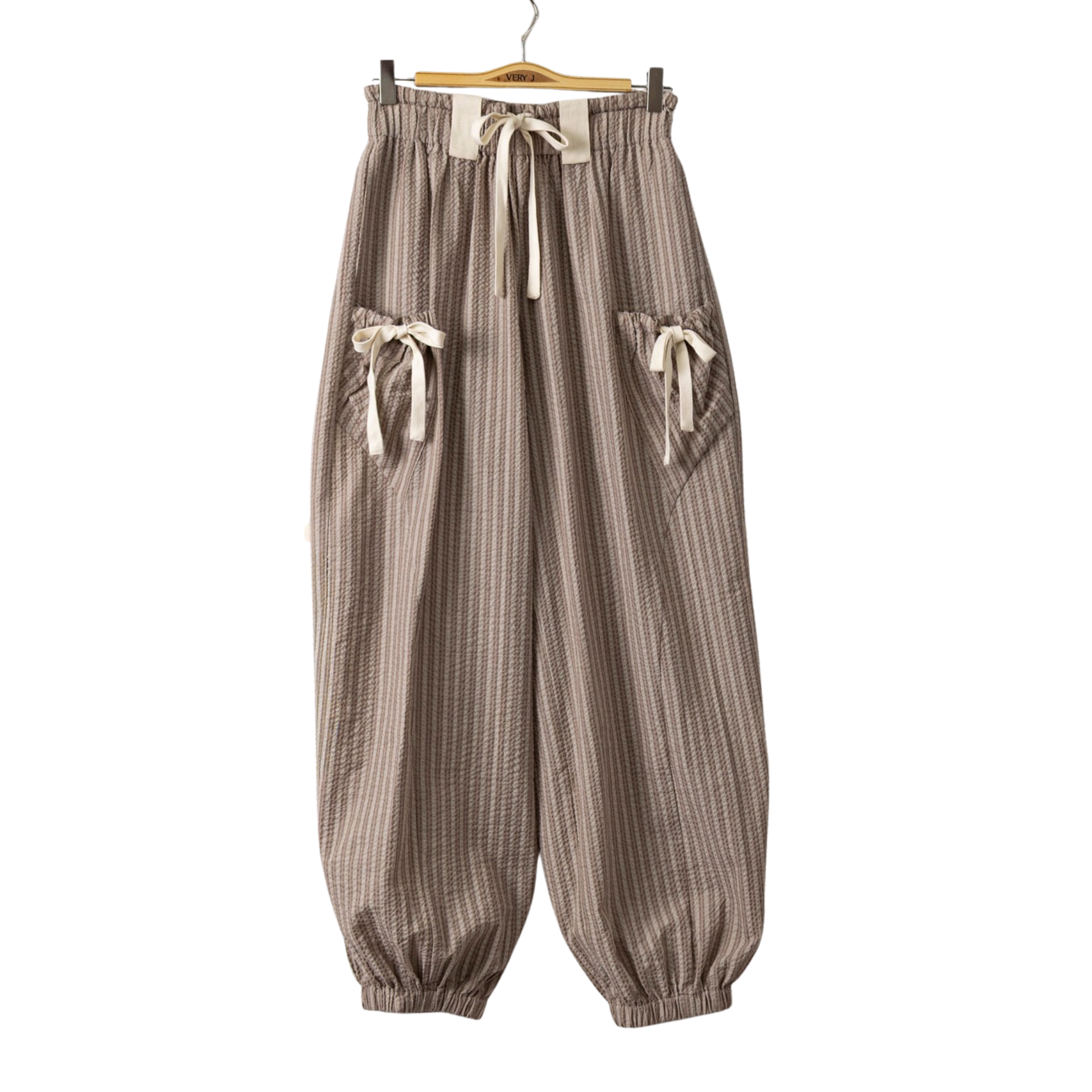 Textured Woven Pants by Very J feature a classic striped pattern in taupe and white, perfect for effortless layering and versatile styling. The comfortable drawstring waist allows for an adjustable fit, while the textured woven fabric adds visual interest and dimension. Ideal for casual days or relaxed outings, these pants deliver both comfort and contemporary style.