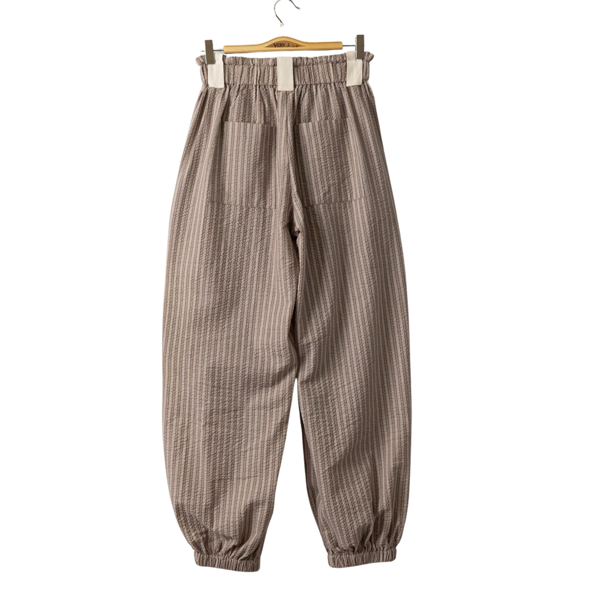 Textured Woven Pants by Very J feature a classic striped pattern in taupe and white, perfect for effortless layering and versatile styling. The comfortable drawstring waist allows for an adjustable fit, while the textured woven fabric adds visual interest and dimension. Ideal for casual days or relaxed outings, these pants deliver both comfort and contemporary style.