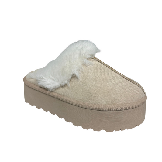 Introducing Super D, the perfect cozy mule from Cozzy Girl Brand. This versatile shoe features a luxurious fur lining in a timeless beige color. Stay warm and stylish all day long with Super D.