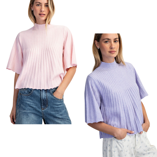 Effortless elegance meets comfort in this Cotierra mock neck swing sweater. Featuring a flattering pleated design and relaxed swing silhouette, it's perfect for layering or wearing solo. Short sleeves keep it versatile for any season, while the mock neck adds a polished touch. Available in soft baby pink or calming lavender—choose your favorite and elevate your everyday wardrobe.