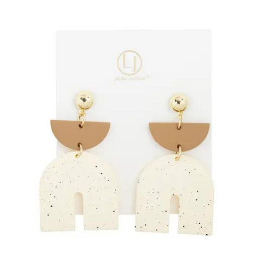 These stylish Clay Arch Earrings feature a tan and white color combination, with a unique speckled pattern. The arch design adds a modern touch, while the dangle style creates an eye-catching look. Elevate your outfit with these statement earrings.