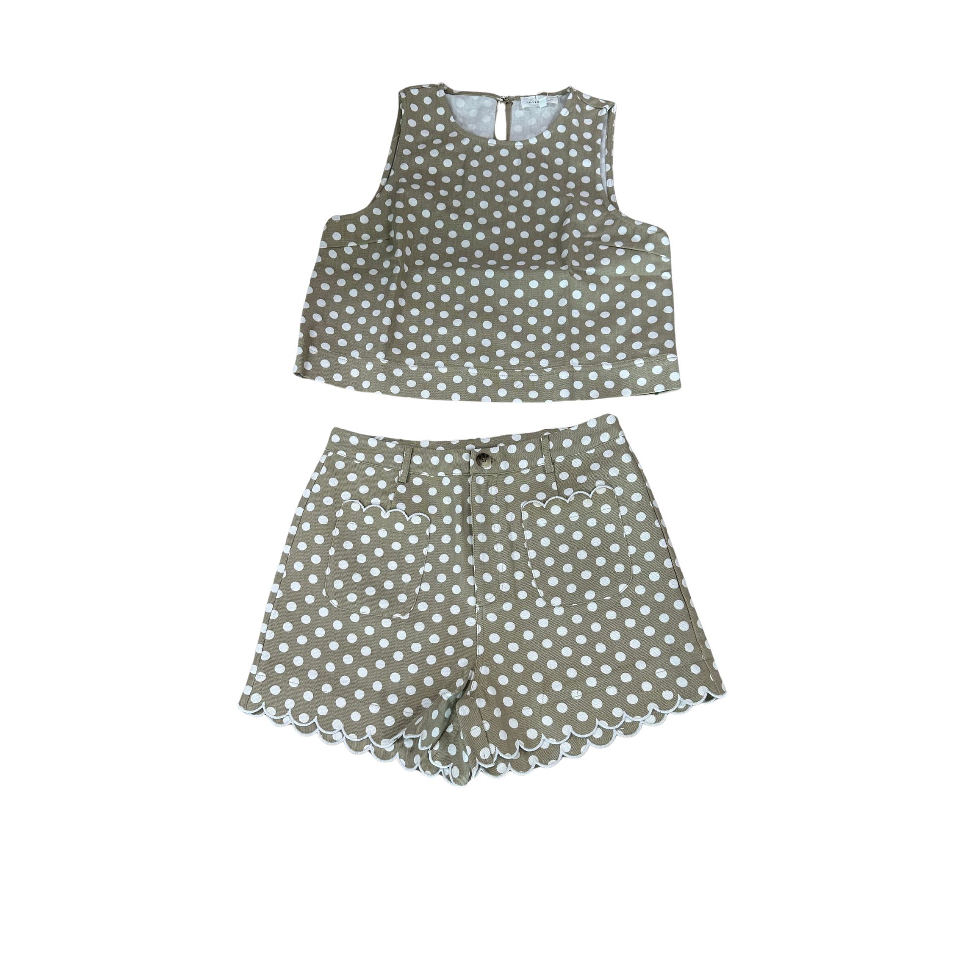 Elevate your casual wardrobe with this charming Entro set featuring a sand-colored sleeveless cropped top adorned with playful polka dots, paired with matching shorts. The cropped silhouette offers a modern, flattering fit perfect for warm weather styling. Mix and match with your favorite accessories for effortless everyday looks or weekend outings. Comfortable, versatile, and on-trend—this two-piece set is a must-have addition to your collection.