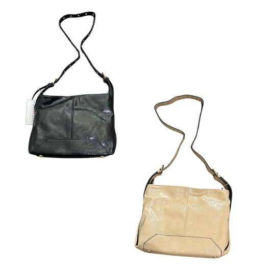The Taylor Tote Bag by Jen &amp; Co. offers a medium-sized design perfect for everyday use. Available in versatile taupe and classic black, this tote combines practicality with style, making it an ideal choice for those seeking a reliable and fashionable accessory.