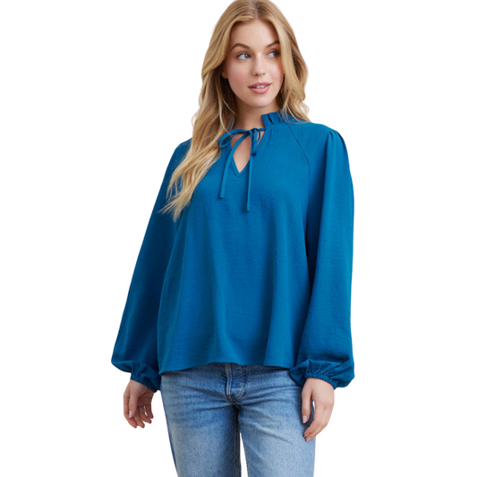 This Bubble Sleeve Top is perfect for making a statement. It features solid, lightweight material, long bubble sleeves, and a frilled self-tie neck closure. The teal color makes this top stand out from the crowd. Get ready to turn heads!