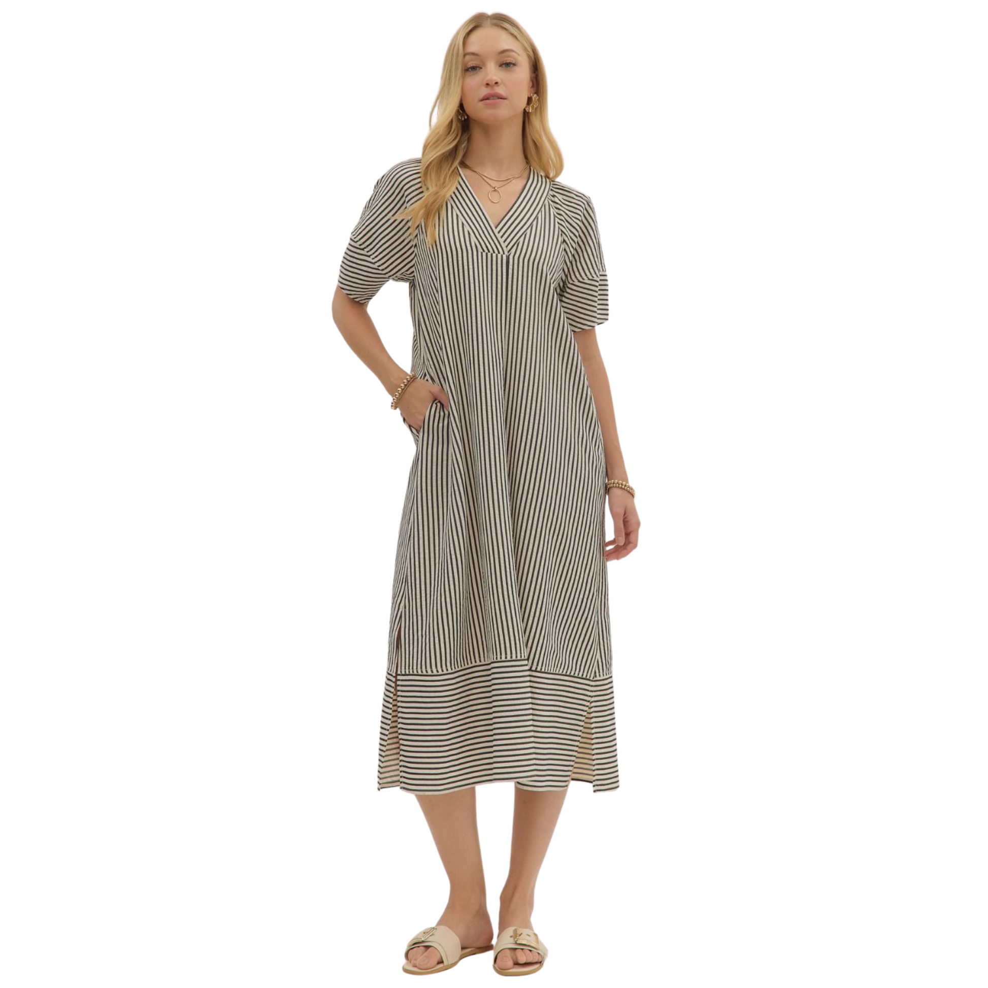 Embrace autumn elegance with the Entro black striped V-neck midi dress. Crafted for fall, its textured fabric offers subtle depth and warmth, while the flattering V-neckline and midi length provide a sophisticated silhouette. Perfect for layering or wearing alone, this dress balances comfort and style for the seasonal transition.