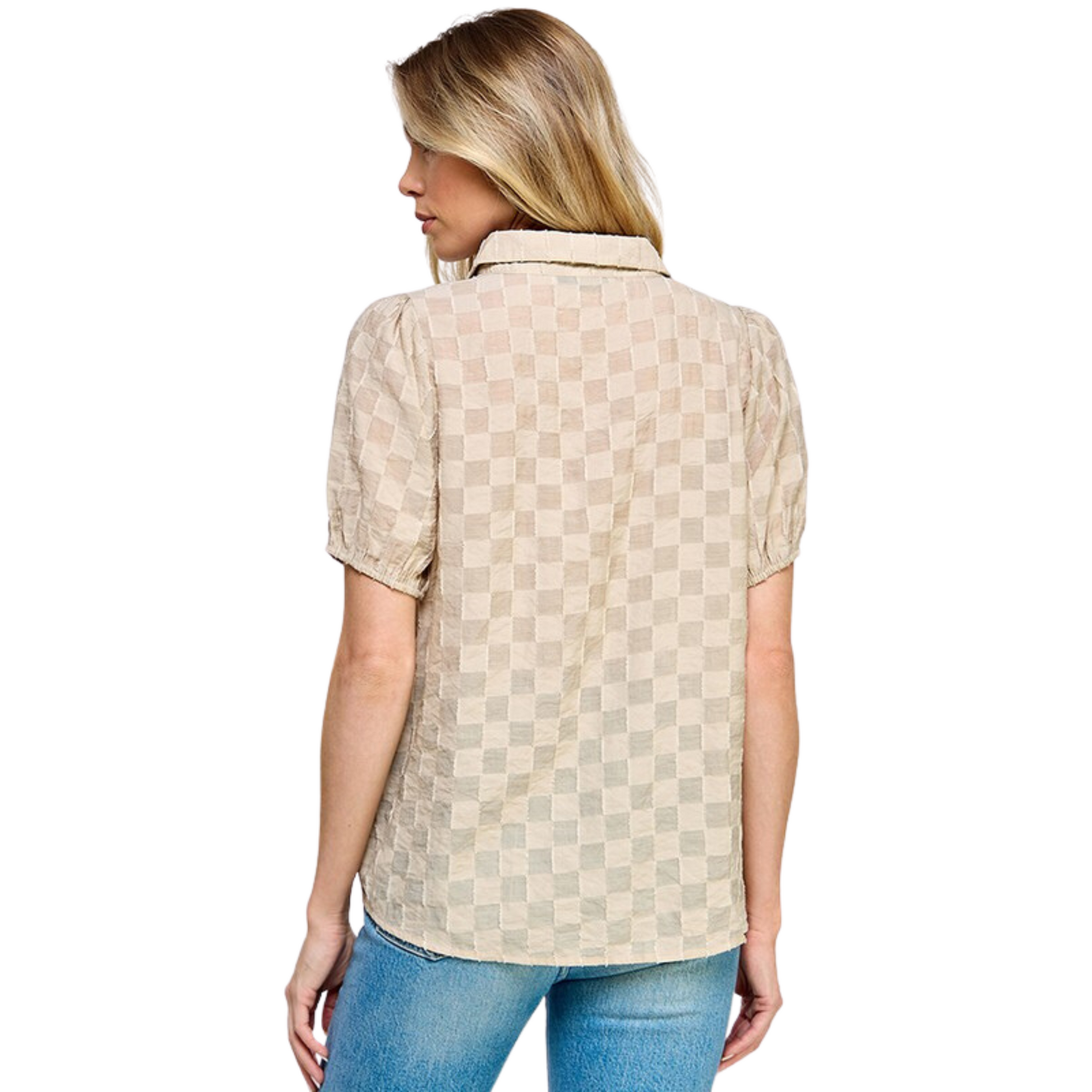 This Textured Short Sleeved Top is made of a cream-colored, textured cotton fabric, featuring a collared neckline with button up closure. Perfect for any occasion, this timeless piece offers a classic look with a touch of modern texture.