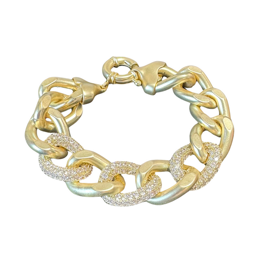 Introducing our Rhinestone Chain Link Bracelet. Crafted with gold and adorned with sparkling rhinestone accents, this bracelet adds a touch of elegance to any outfit. Its thick chain link design provides durability and a bold, stylish statement. Elevate your look with this stunning bracelet.