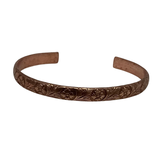 This stylish bronze bangle is perfect for everyday wear! The intricate flower design adds a beautiful touch of elegance to any ensemble. The cuff bangle shape is highly versatile, ensuring you'll be able to rock this piece for any occasion.
