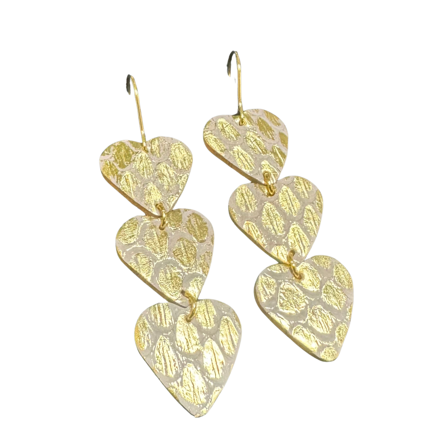 These elegant Three Heart Earrings by Amanda Blu feature a beautiful design of three hearts with delicate gold accents. The dangle style adds a touch of sophistication to any outfit. Perfect for any occasion, these earrings are a must-have for any jewelry collection.