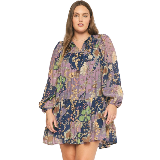 Enjoy effortless style with this beautiful long sleeve tiered mini dress. Crafted from a lightweight fabric featuring a floral print and self-tie detail at the neckline, this mini dress is perfect for any type of occasion. The pockets at the side and tiered hem provide extra convenience and style.