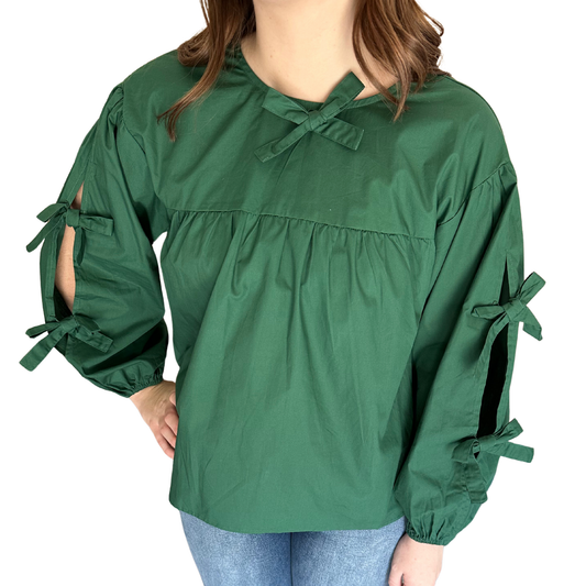 This Jodifl tie sleeve top features long sleeves accented with elegant tie details, adding a refined touch to its classic silhouette. Crafted in a versatile green shade, it combines style with comfort, making it ideal for both professional and casual settings. The subtle sleeve ties enhance movement while maintaining a polished appearance.
