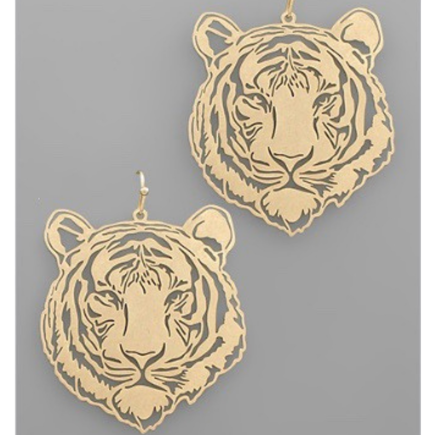 These Tiger Filigree Earrings boast an elegant worn gold finish, featuring intricate filigree detailing. Crafted in a stylish tiger shape, these dangle earrings are the perfect accessory for any fashionable outfit. Add a touch of sophistication and wild flair to your look.