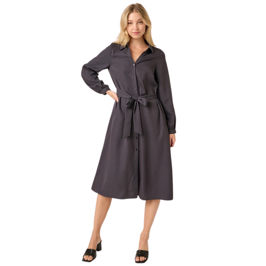 Look sharp and professional in this Titanium Waist Tie Shirt Dress! Styled with a collar accent, V-neck, and front placket with button closure, this dress offers a classic, tailored look. Its long sleeves have cuff bands, and its sides feature pockets for added convenience. Perfect for the office and beyond!