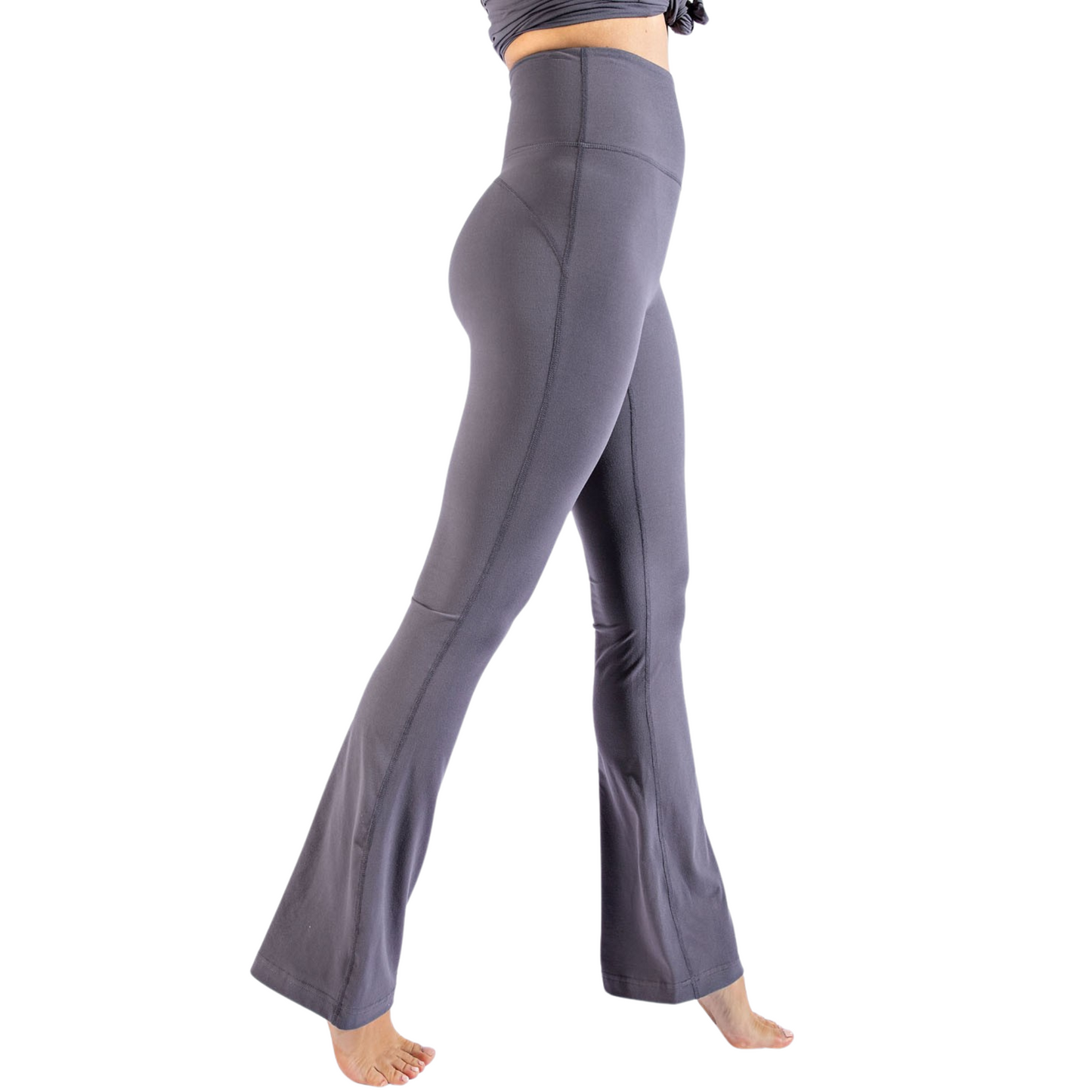 Upgrade your yoga sessions with our Hi Waist Flared Yoga Pants by Rae Mode. The titanium grey color offers a sleek, modern look while the flared and bell bottom design adds a touch of femininity. The high waist provides optimal support and flexibility, allowing you to focus on your practice. Made with our signature "butter soft" material, these pants will keep you comfortable and stylish.