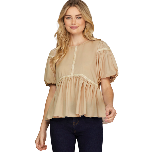 Effortless style meets comfort in this taupe babydoll top from She+Sky. The short sleeves and flattering silhouette create a relaxed, feminine look perfect for everyday wear. Trim detailing adds a subtle touch of sophistication to this versatile wardrobe essential.