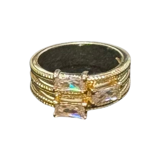This elegant size 7 ring features a sophisticated triple rhinestone design set on a gleaming gold band. The carefully arranged rhinestone accents add a refined sparkle, making it a standout piece for both everyday wear and special occasions. Expertly crafted to combine timeless style with subtle glamour.
