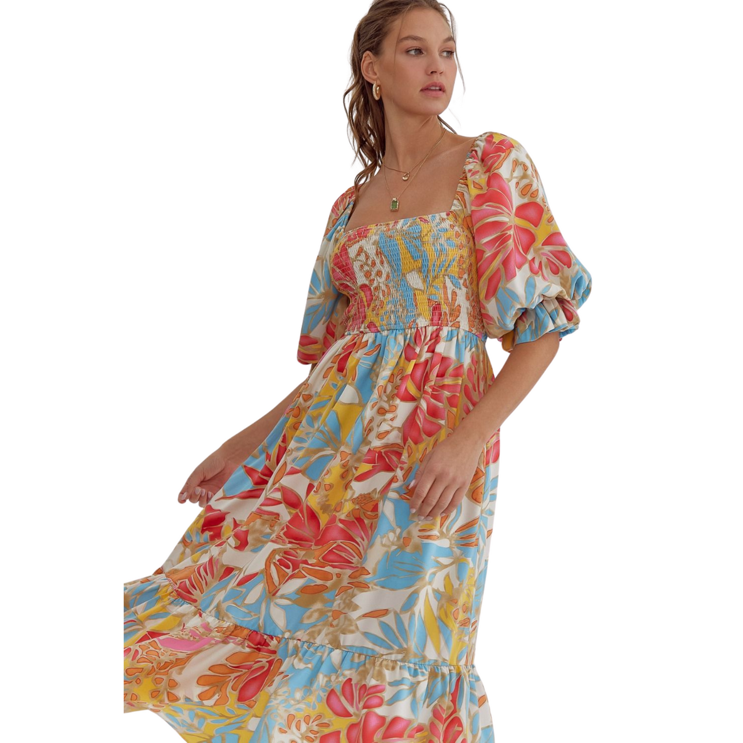 Add some color to your wardrobe with our Tropical Print Midi Dress. Featuring a square neck and half sleeves, this midi dress is perfect for any occasion. The smocking detail at the back ensures a comfortable and flattering fit. With elasticized sleeves and a lightweight, non-sheer fabric, you'll look and feel great all day long.