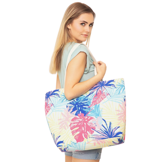 The Tropical Tote is perfect for days at the beach or when you're on the go. Its unique tropical print and pink, blue and green colors will make you stand out in the crowd. Crafted from lightweight material, this beach bag is durable and travel-friendly.