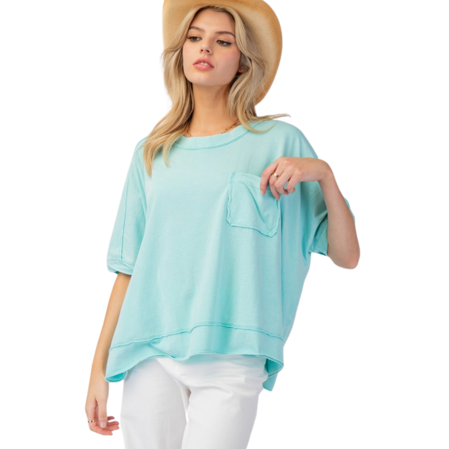 This Mineral Washed Jersey Knit Top by Easel is a must-have for any wardrobe. The beautiful turquoise blue color adds a pop of color while the drop shoulder and short sleeves provide a comfortable fit. Complete with a pocket, this top is both stylish and functional.