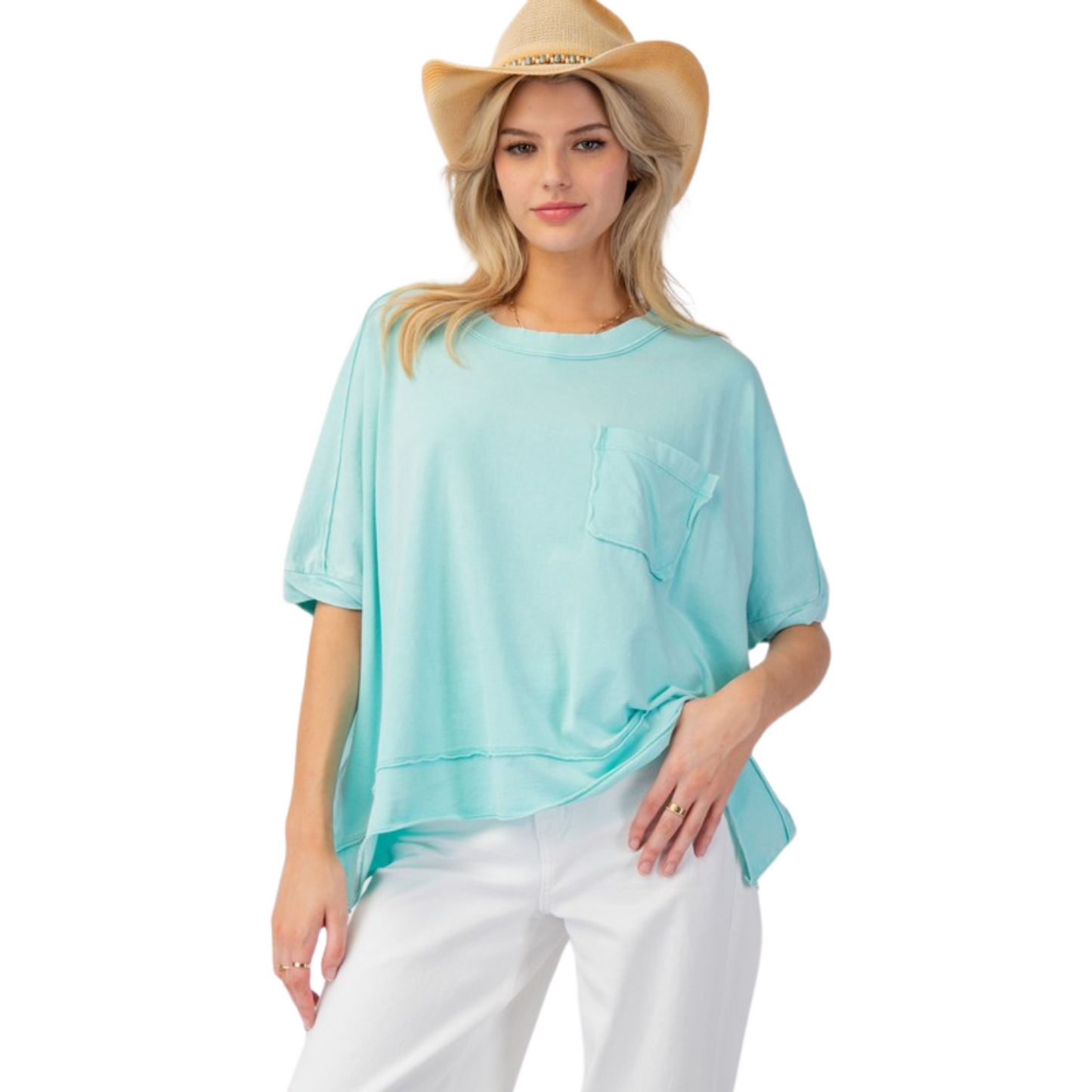 This Mineral Washed Jersey Knit Top by Easel is a must-have for any wardrobe. The beautiful turquoise blue color adds a pop of color while the drop shoulder and short sleeves provide a comfortable fit. Complete with a pocket, this top is both stylish and functional.