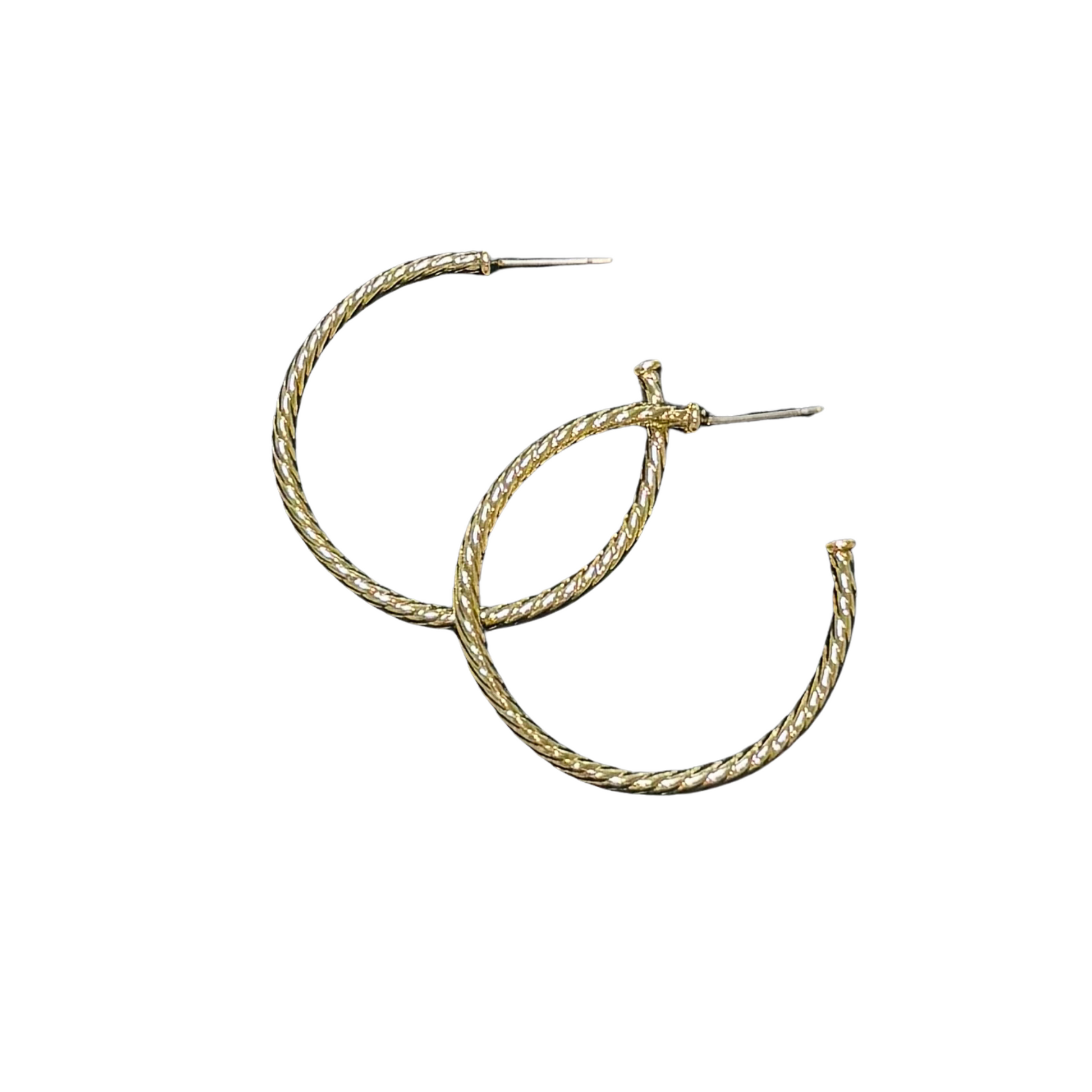 Upgrade your earring game with our Twisted Hoop Earrings. Made of high-quality gold, these medium-sized hoops feature a unique twisted design that adds a touch of elegance to any outfit. Perfect for a subtle yet stylish look.