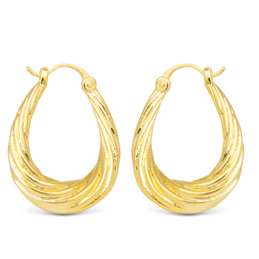 Crafted by the experts at Amanda Blu, our Chunky Twisted Hoops feature a unique twisted design that adds a touch of elegance to the classic oval hoop shape. Made with high-quality gold, these hoops are perfect for any occasion and will elevate any outfit.