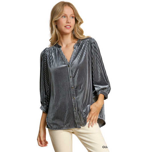 This V-Notched Button Down Top adds a touch of luxury to any outfit with its velvet fabric. The gunmetal grey color offers a textured appearance, adding dimension to your ensemble. With 3/4 length sleeves, it's perfect for transitioning from day to night.