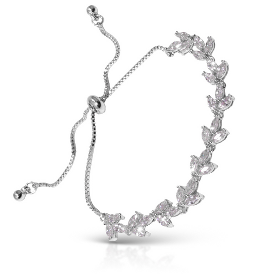 As a stunning accessory for any outfit, the Vine Pull-Chord Bracelet showcases a delicate silver vine design and sparkling rhinestone accents. With a convenient pull-chord adjustment, this bracelet is both stylish and functional. Perfect for adding a touch of elegance to your look.