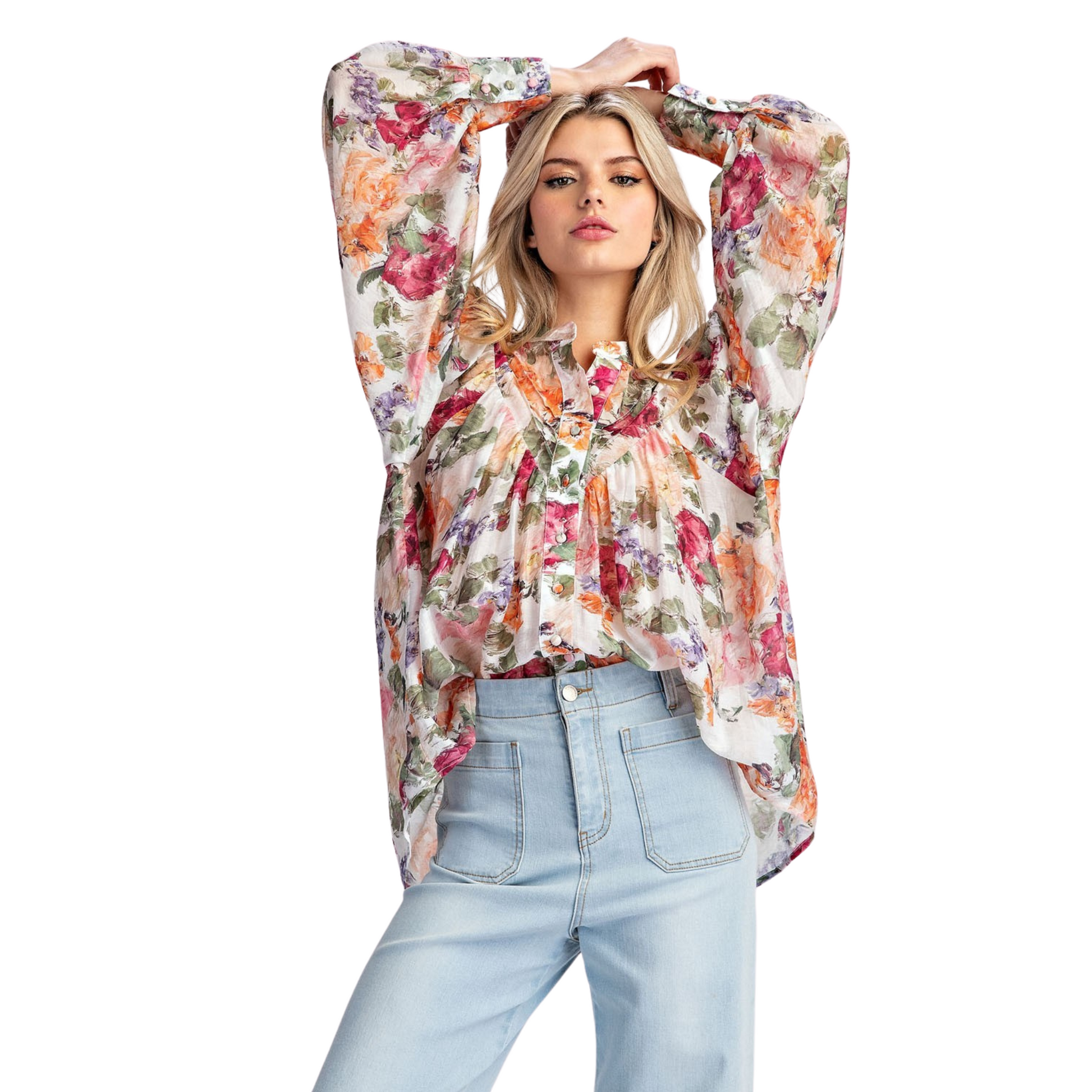 This vintage floral printed blouse is a timeless addition to any wardrobe. The rounded neckline, button down front, and added pleats create a flattering and relaxed silhouette. With buttoned cuffs and a slightly bubbled sleeve effect, this blouse exudes both elegance and comfort.