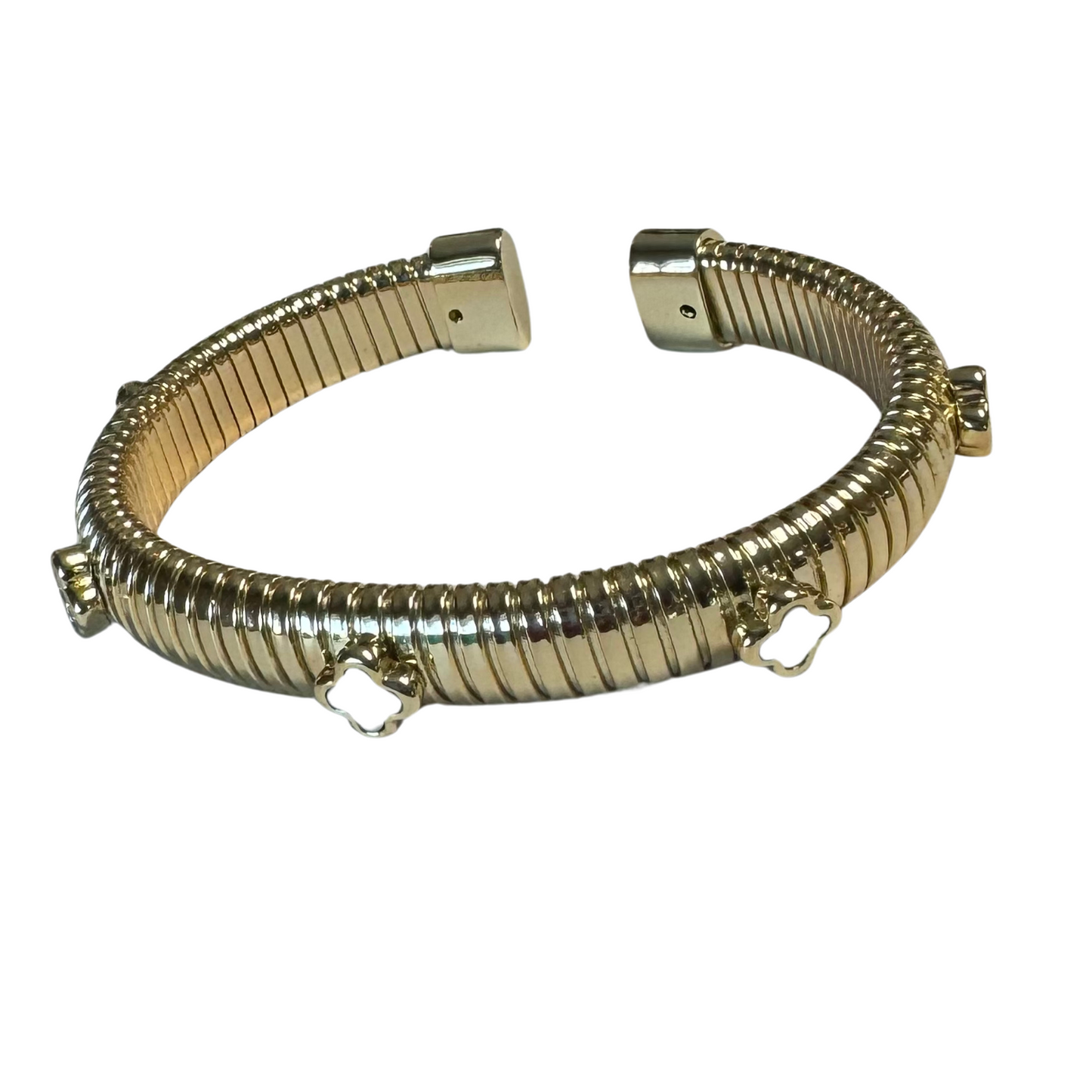 Expertly crafted with a gold bangle and elegant white clover design, this bracelet adds a touch of sophistication to any outfit. Indulge in the unique charm of this accessory, perfect for any occasion.
