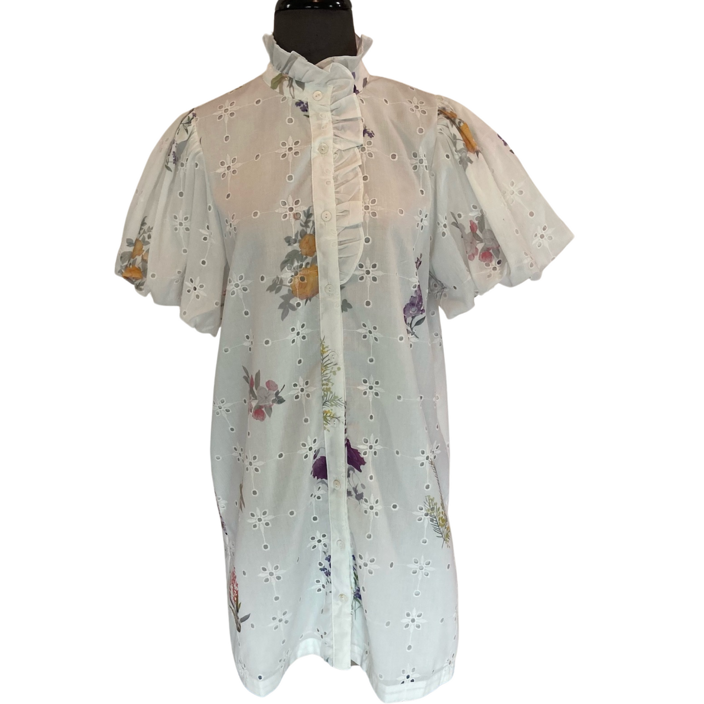 Experience the perfect blend of elegance and charm with our Floral Mini Dress by Entro. Featuring a stunning white base accented by a vibrant multicolor floral pattern, this button up mini dress is the epitome of sophistication. Elevate your style and feel confident in this must-have addition to your wardrobe.