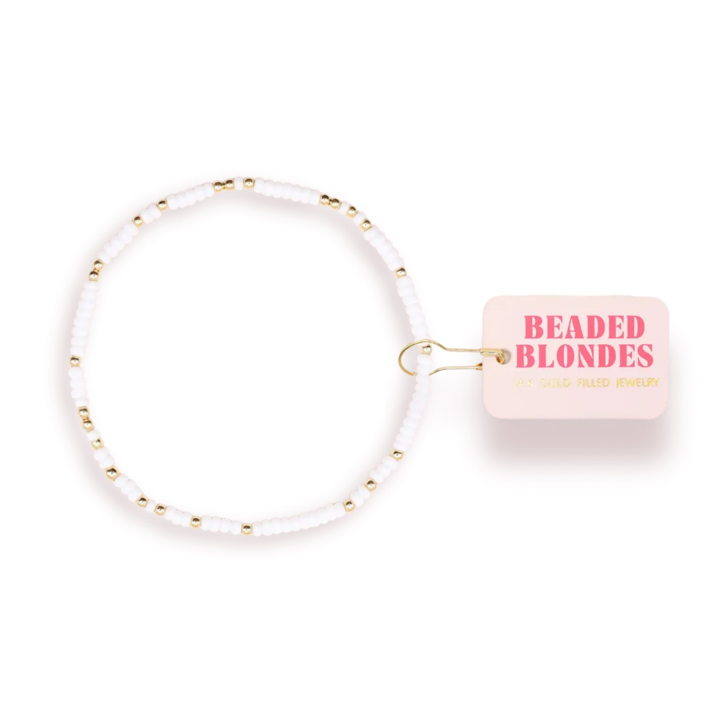 Elevate your wrist with the Sprinkle Bracelet from Beaded Blondes. This stretchy bracelet features a stunning combination of white and gold beads that catch the light beautifully. Perfect for layering or wearing solo, it adds a touch of elegance to any outfit. The comfortable stretch fit ensures all-day wear without slipping. A versatile accessory that transitions seamlessly from casual to dressed-up occasions.
