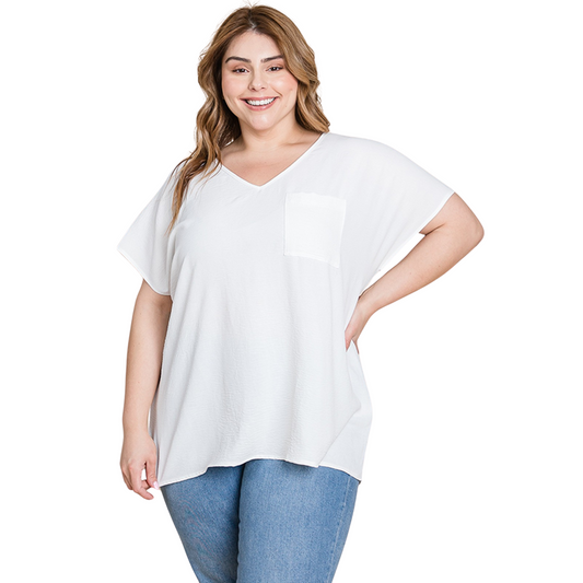 This women's short sleeve top features a flattering v-neck design and a front pocket for added functionality. The loose fit allows for comfortable wear and stylish versatility. A classic white color makes it easy to pair with any outfit. Perfect for a casual yet put-together look.
