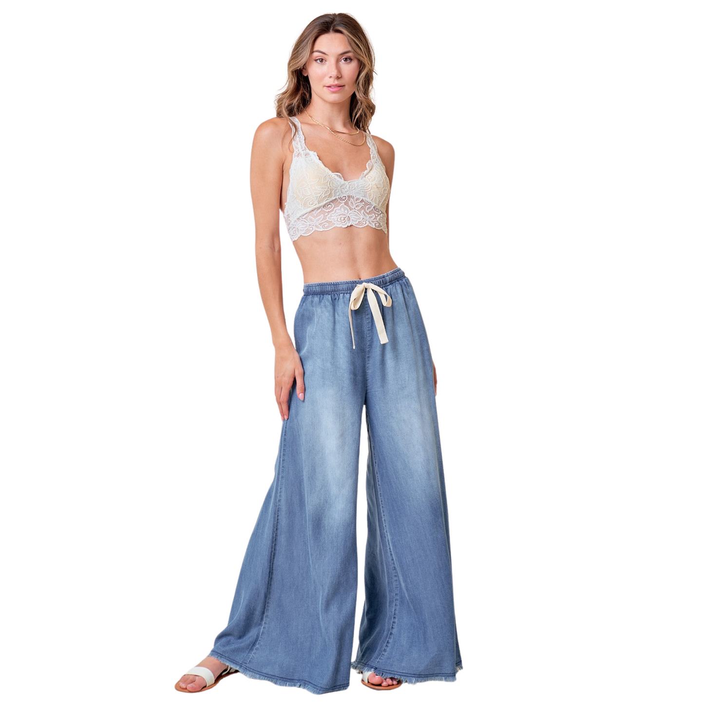 These wide leg denim pants are perfect for any casual outing. The light wash adds a touch of style while the drawstring allows for a customizable fit. Made from high-quality denim, these pants provide both comfort and fashion for any occasion.