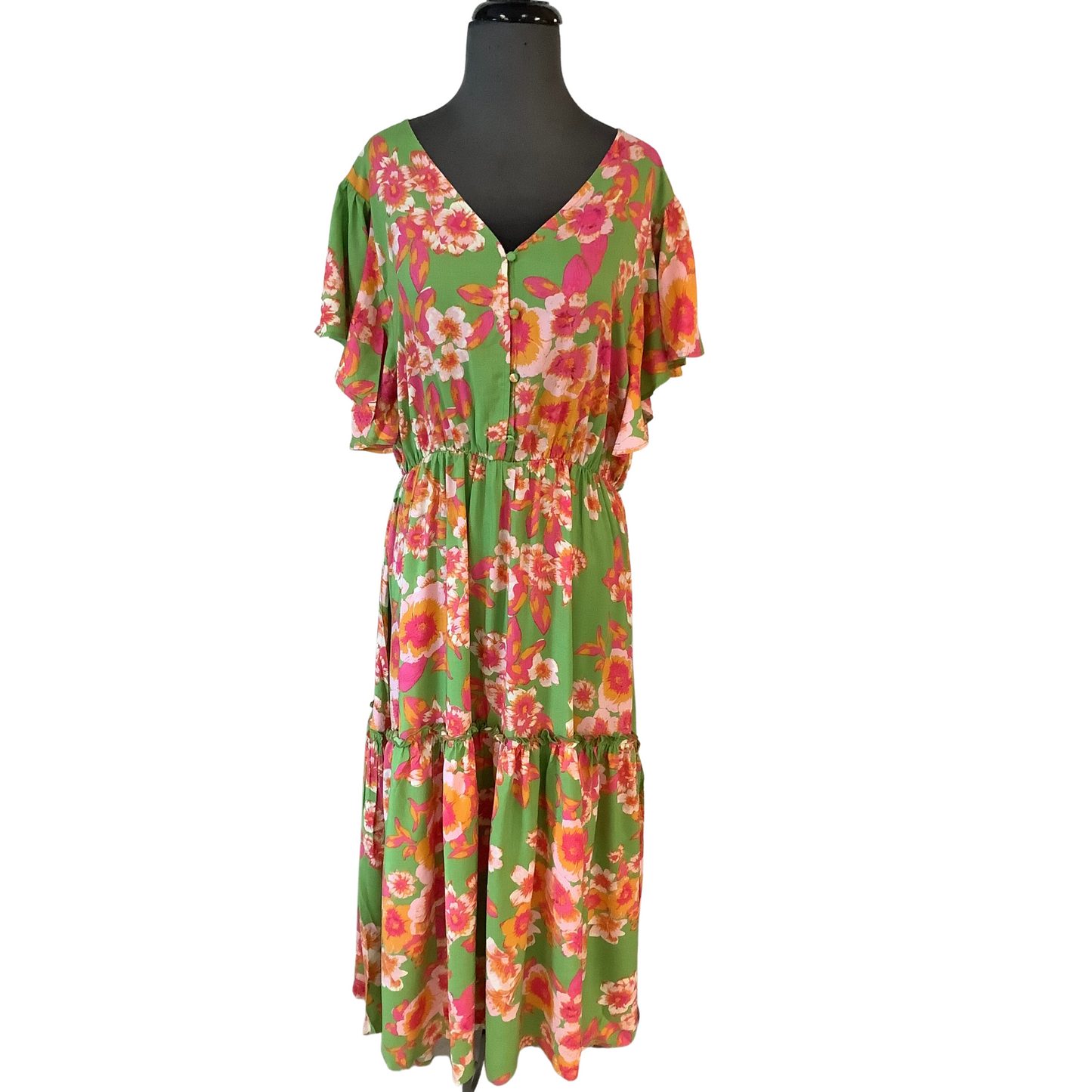 This lovely maxi dress features a v-neckline and a delicate floral print. Its striking winged sleeves and tiered skirt make it a stylish and fashionable choice for any formal occasion.  This plus size maxi dress boasts an elegant silhouette with a v-neck and short, fluttery sleeves. The tiered design creates a beautiful figure-flattering look that is perfect for any occasion.