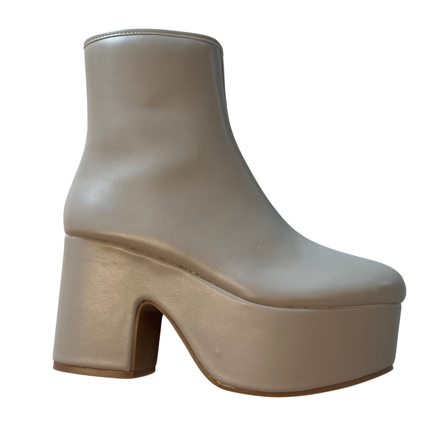 The Xiva by Shushop features a mink color platform bootie that stands out in any outfit. Its durable construction ensures long-lasting comfort, and the zip up design ensures a secure fit for all-day use. Whether you're looking for a stylish statement or a comfortable everyday shoe, the Xiva checks all the boxes.
